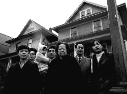 Mary and her family in front of their house on Keefer Street